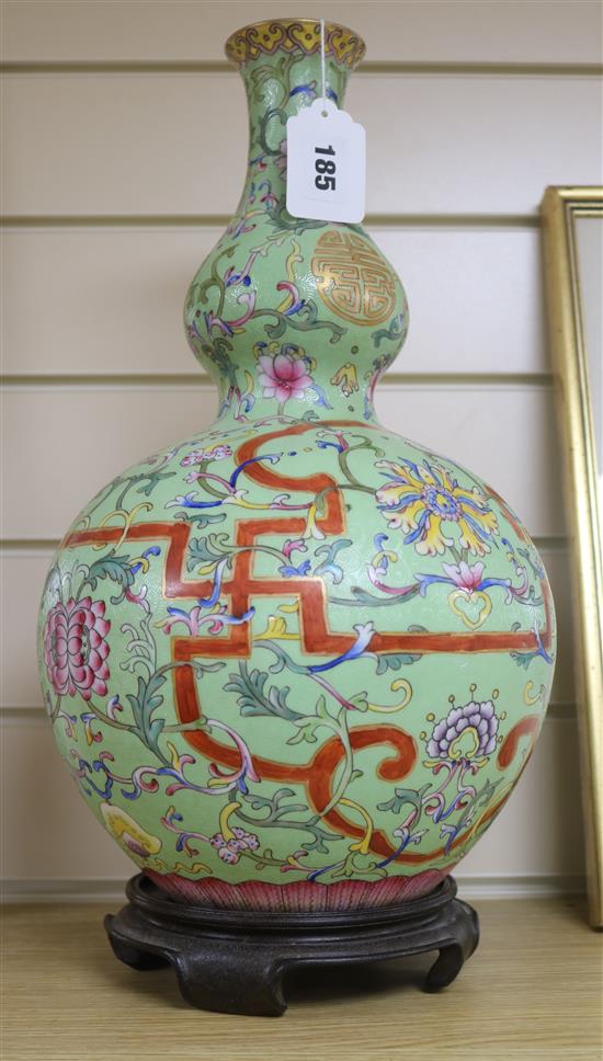 A Chinese lime green sgraffito ground vase